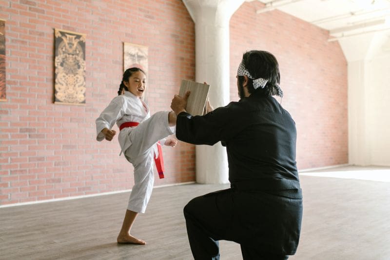 instructor teaching benefits of kids martial arts