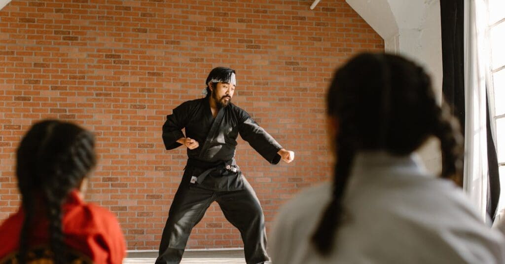 Instructor teaching foundational movements during martial arts training for beginners class