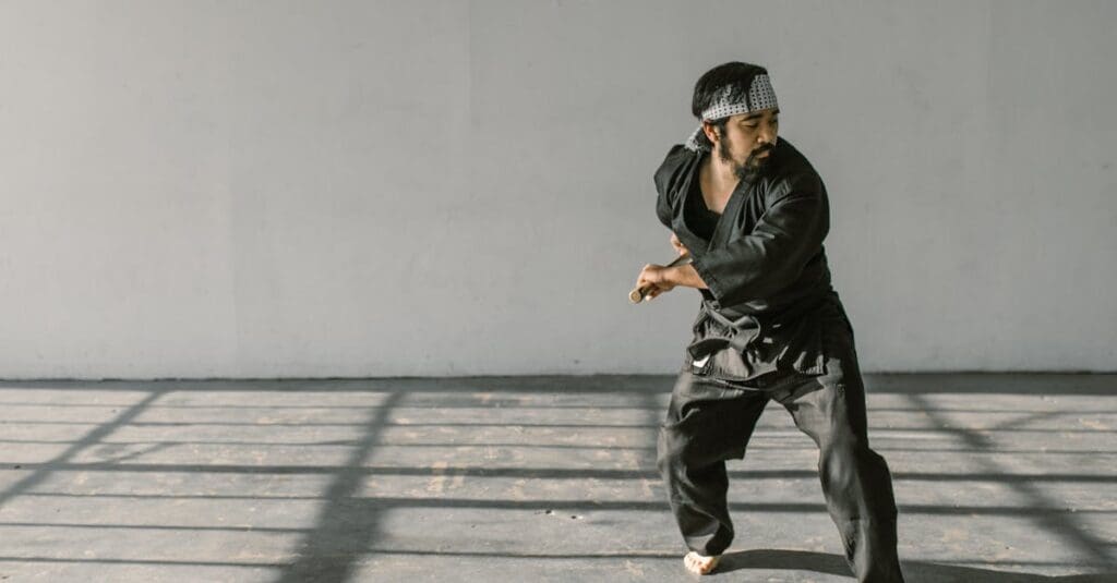 Martial artist performing movement technique practice in martial arts training for beginners